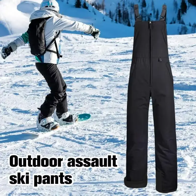 Snowboarder in black BenBoy snow pants next to a black snow bib