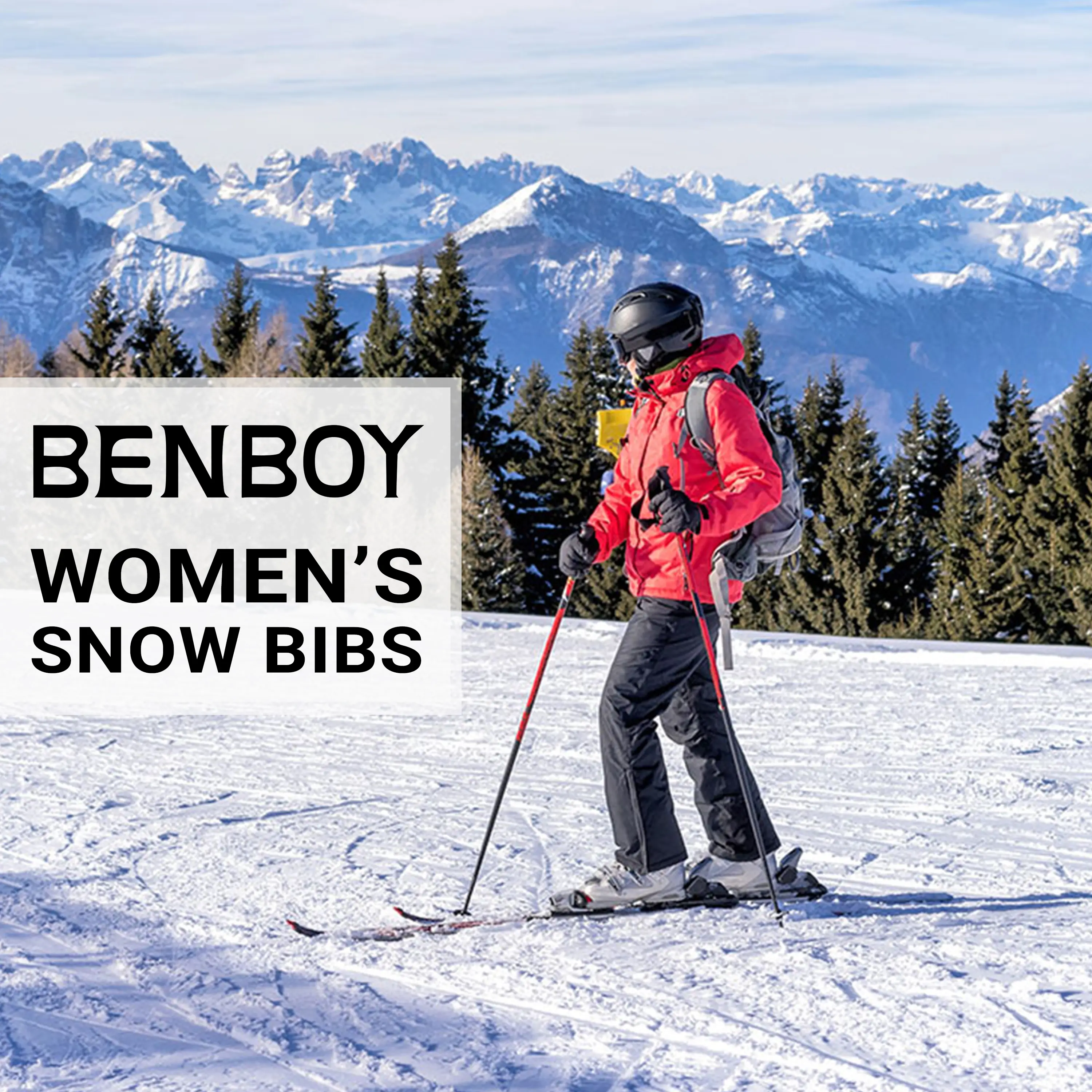 Skier in a red jacket and grey BenBoy women's snow bibs on a sunny mountain slope